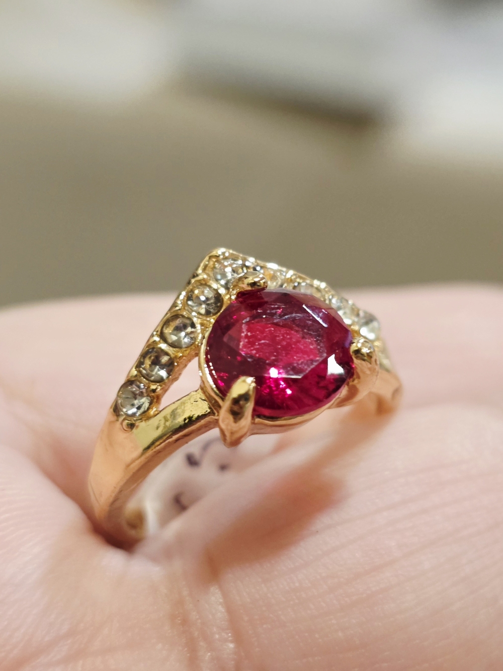 18k Gold-Plated Ring with Deep Red Oval Gemstone and Clear Accents